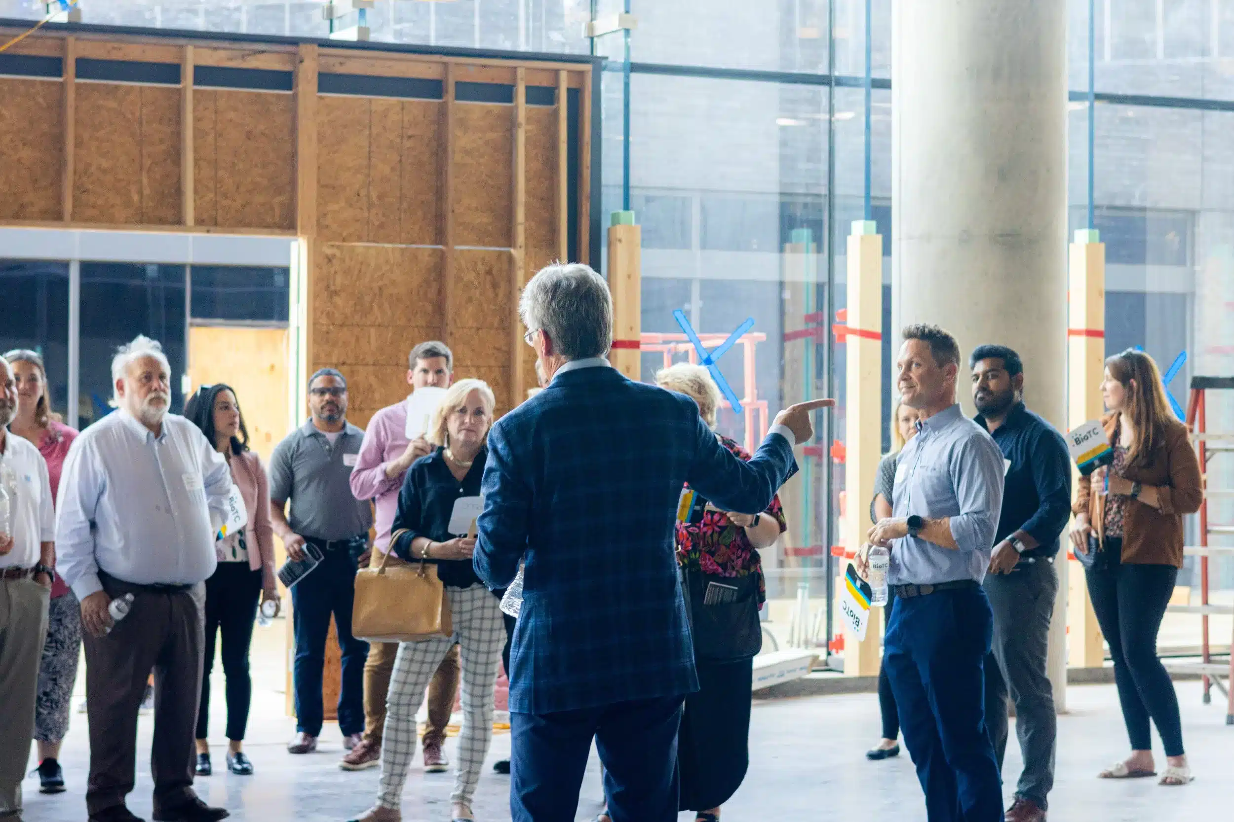Mark Beffort addresses visitors touring The Tower at Convergence during construction.