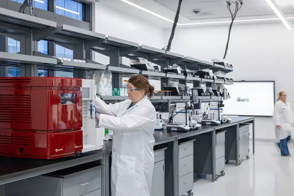 Dr. Kelley Dowd works with laboratory equipment in the BioTC lab.