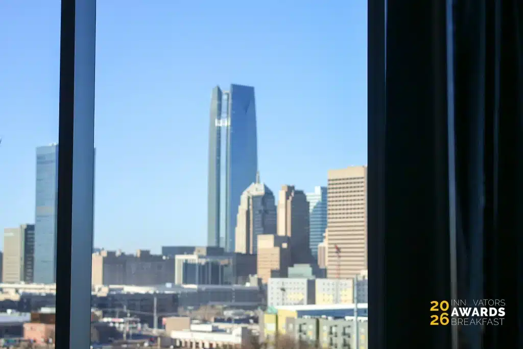Downtown Oklahoma City skyline viewed through a window at the Innovators Awards Breakfast venue.