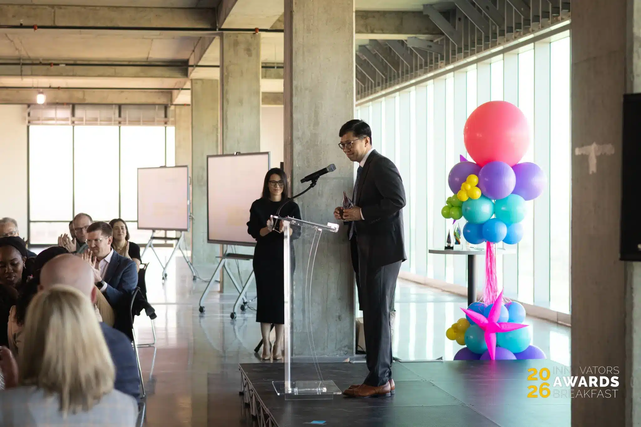 Dr. Chen accepts the Outstanding Research and Development Award in Biology at the Innovators Awards Breakfast.