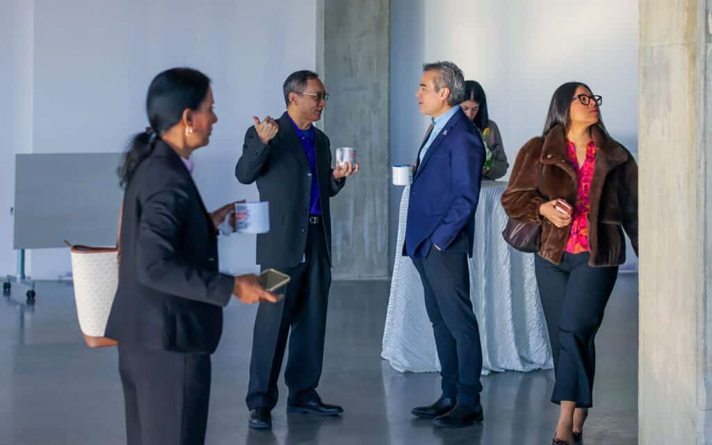 Guests talk together at an Oklahoma City Innovation District breakfast event.