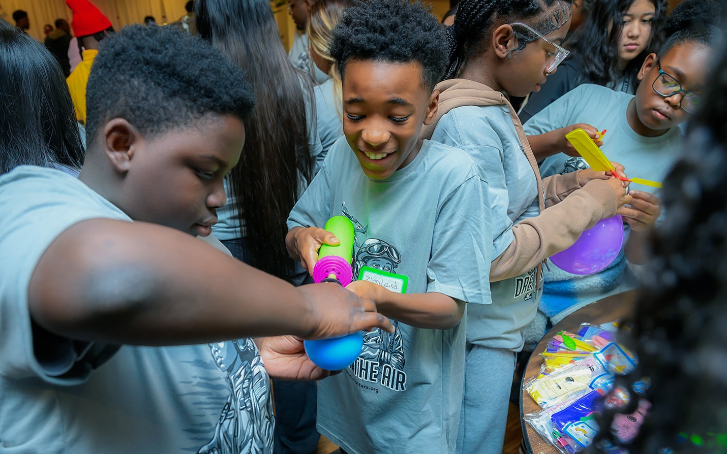 Students explore colorful science models during a hands-on Innovation Week activity.