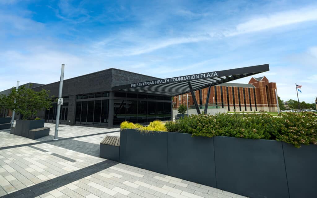 Innovation Hall exterior and Presbyterian Health Foundation Plaza with landscaped planters.