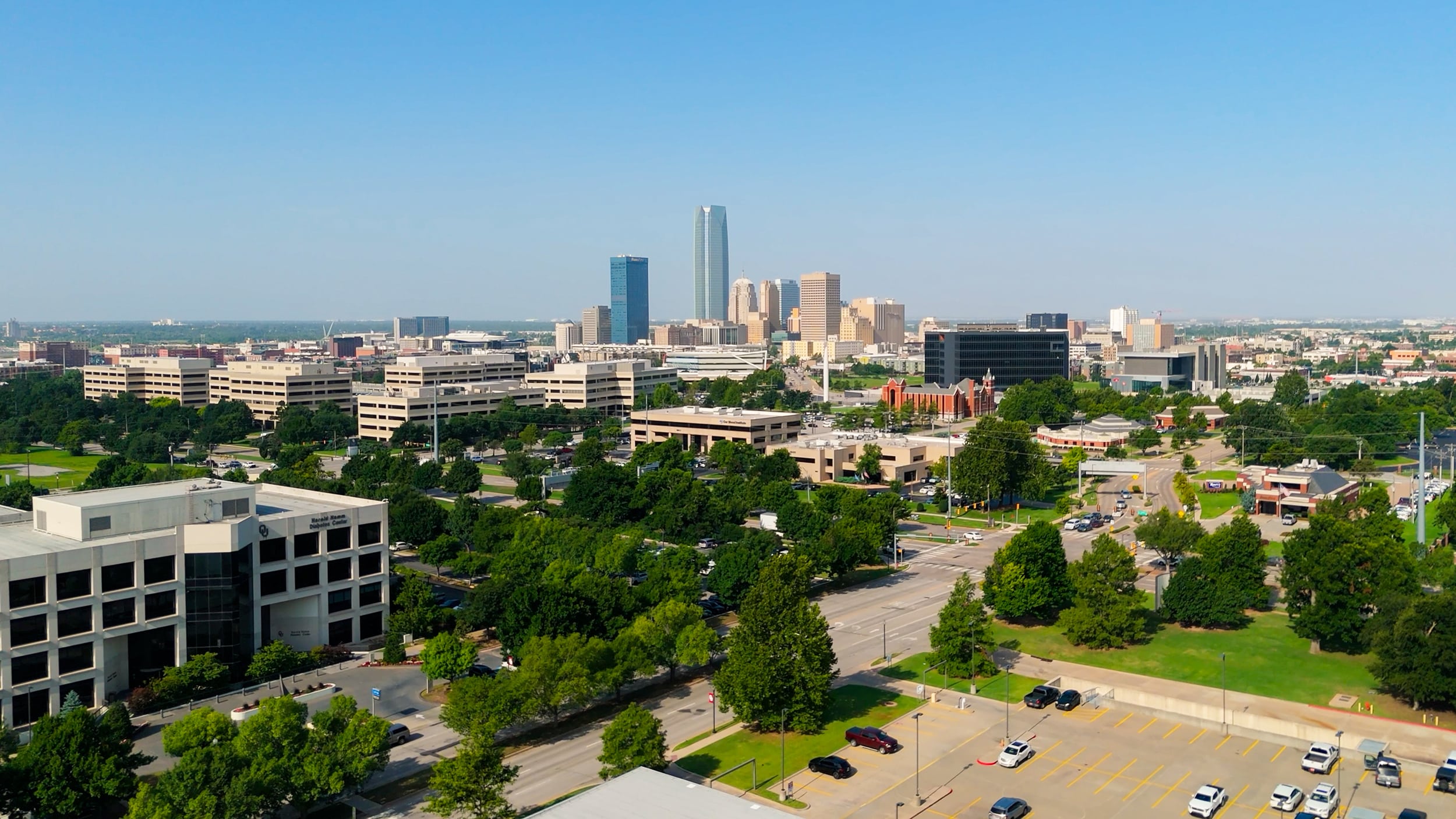 Aerial view across Stiles Park and the Innovation District toward downtown Oklahoma City.